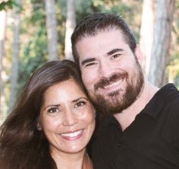 Senior Pastor Caleb Beller and his wife Kim Beller standing together, smiling at Calvary Chapel Fullerton